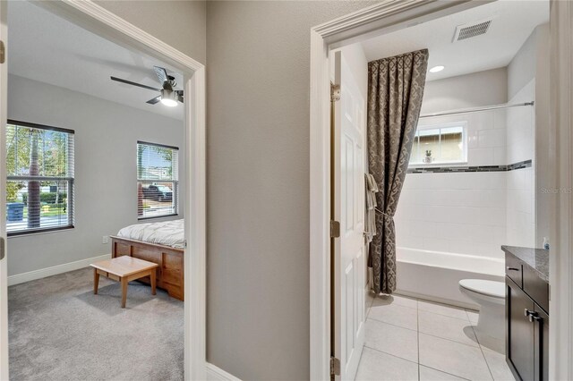 6127 Colmar Pl, Apollo Beach, FL 33572 - full bathroom with shower / tub combo with curtain, toilet, vanity, a ceiling fan, and baseboards