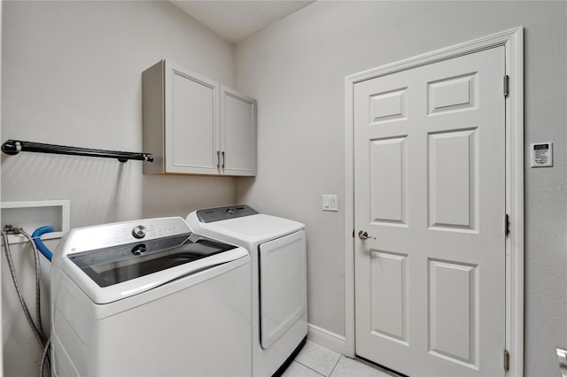 6127 Colmar Pl, Apollo Beach, FL 33572 - washroom with independent washer and dryer, cabinet space, light tile patterned floors, and baseboards