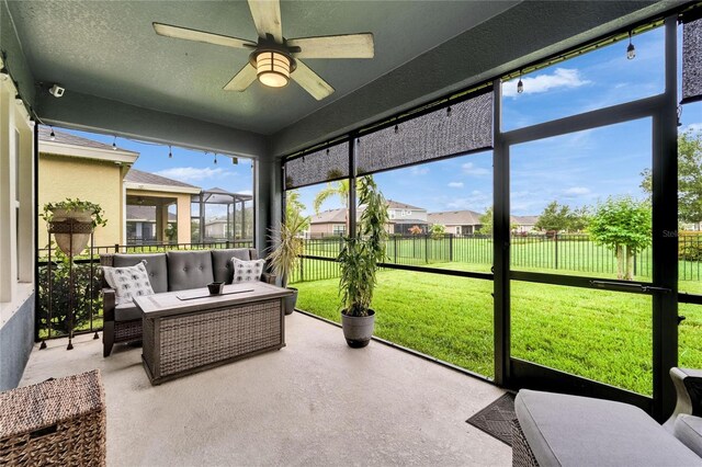 6127 Colmar Pl, Apollo Beach, FL 33572 - sunroom with a ceiling fan, outdoor lounge area, and a residential view