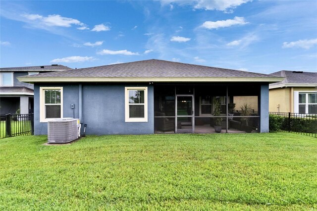 6127 Colmar Pl, Apollo Beach, FL 33572 - rear view of house featuring cooling unit, stucco siding, a sunroom, and a shingled roof