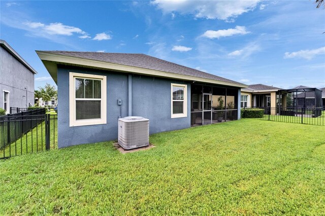 6127 Colmar Pl, Apollo Beach, FL 33572 - back of property featuring central air condition unit, stucco siding, and a sunroom