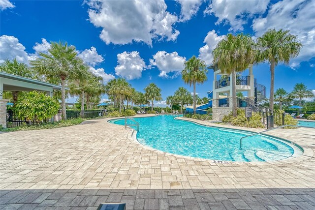 6127 Colmar Pl, Apollo Beach, FL 33572 - community pool with a patio area, a water slide, and stairway