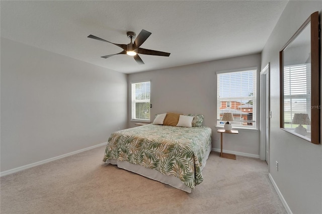 449 Bahama Grande Blvd, Apollo Beach, FL 33572 - carpeted bedroom with baseboards, a ceiling fan, and a textured ceiling