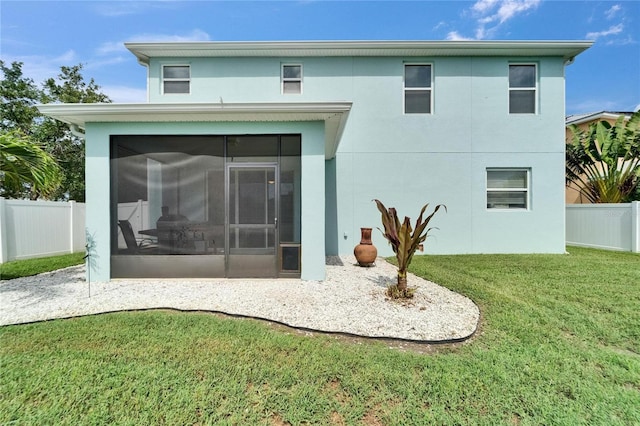 449 Bahama Grande Blvd, Apollo Beach, FL 33572 - back of house featuring a sunroom and stucco siding