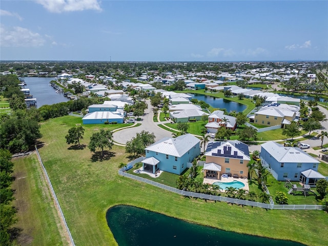 449 Bahama Grande Blvd, Apollo Beach, FL 33572 - aerial perspective of suburban area featuring a large body of water and a pool
