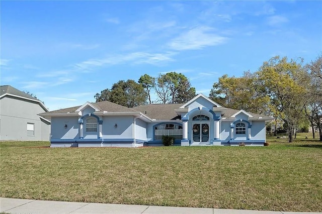13377 Elise Ln, Spring Hill, FL 34609 - ranch-style home featuring a front lawn and stucco siding