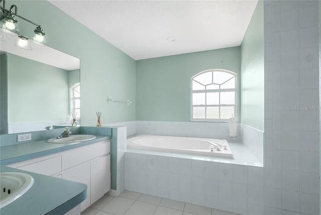 13377 Elise Ln, Spring Hill, FL 34609 - full bath with a garden tub, tile patterned floors, vanity, and healthy amount of natural light