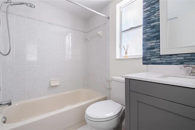 13377 Elise Ln, Spring Hill, FL 34609 - full bathroom featuring vanity, toilet, and tub / shower combination