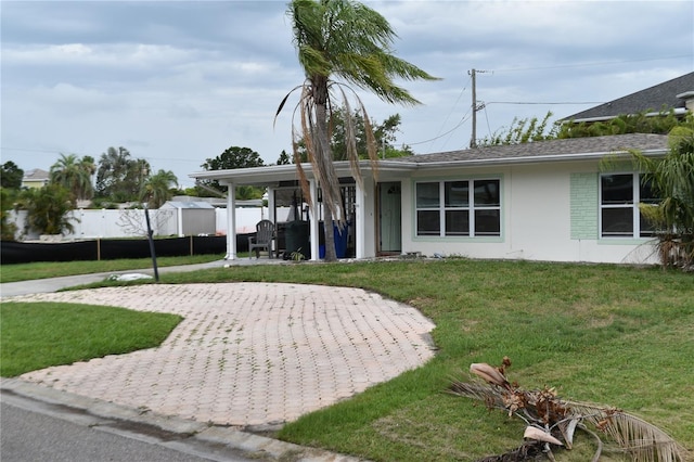 2470 Del Rio Way, Dunedin, FL 34698 - view of front of home with stucco siding