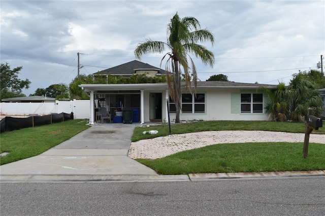 2470 Del Rio Way, Dunedin, FL 34698 - view of front facade featuring concrete driveway and stucco siding