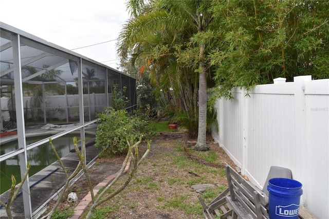 2470 Del Rio Way, Dunedin, FL 34698 - view of yard featuring glass enclosure