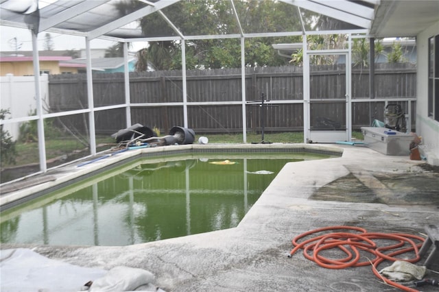 2470 Del Rio Way, Dunedin, FL 34698 - view of pool featuring a fenced backyard, glass enclosure, and a patio area