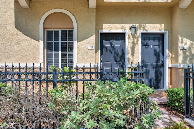 113 S Sherrill St Unit 113, Tampa, FL 33609 - doorway to property featuring stucco siding