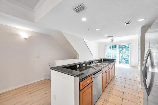 113 S Sherrill St Unit 113, Tampa, FL 33609 - kitchen with stainless steel appliances, a sink, recessed lighting, a center island with sink, and light wood-style flooring
