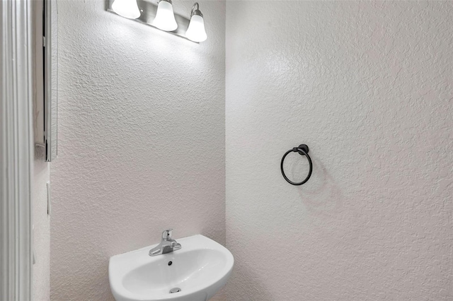 113 S Sherrill St Unit 113, Tampa, FL 33609 - bathroom with a sink and a textured wall