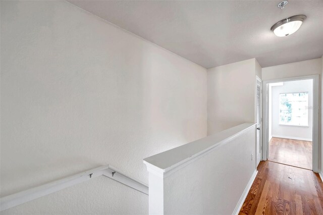 113 S Sherrill St Unit 113, Tampa, FL 33609 - hall featuring an upstairs landing, wood finished floors, and baseboards