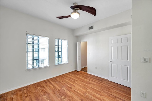 113 S Sherrill St Unit 113, Tampa, FL 33609 - unfurnished bedroom with light wood-type flooring, baseboards, and ceiling fan