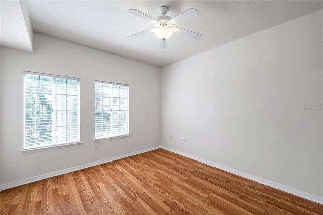 113 S Sherrill St Unit 113, Tampa, FL 33609 - spare room with light wood-style floors, baseboards, and a ceiling fan
