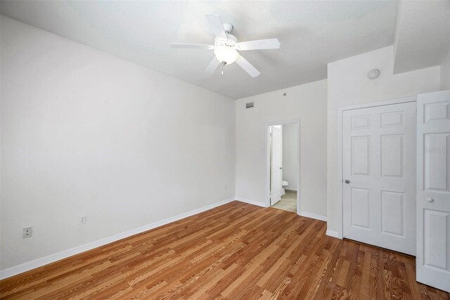 113 S Sherrill St Unit 113, Tampa, FL 33609 - unfurnished bedroom with baseboards, wood finished floors, and ceiling fan