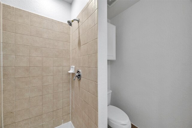 113 S Sherrill St Unit 113, Tampa, FL 33609 - bathroom with a tile shower and toilet