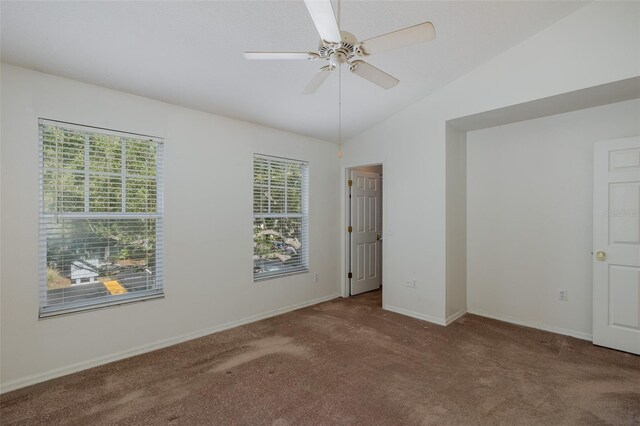 13521 Forest Lake Dr, Largo, FL 33771 - unfurnished bedroom with carpet, multiple windows, lofted ceiling, baseboards, and ceiling fan