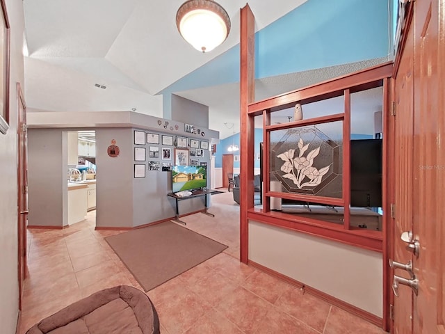 13094 Huntington Woods Ave, Spring Hill, FL 34609 - tiled foyer with lofted ceiling and baseboards