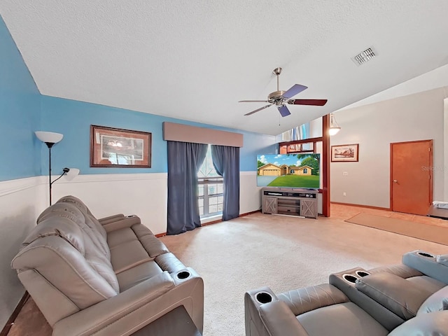 13094 Huntington Woods Ave, Spring Hill, FL 34609 - living area featuring vaulted ceiling, a ceiling fan, carpet, baseboards, and a textured ceiling