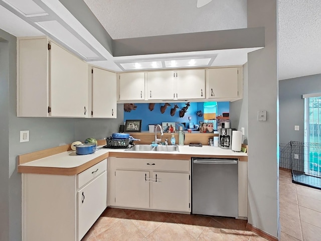13094 Huntington Woods Ave, Spring Hill, FL 34609 - kitchen featuring stainless steel dishwasher, a sink, light countertops, light tile patterned flooring, and a textured ceiling