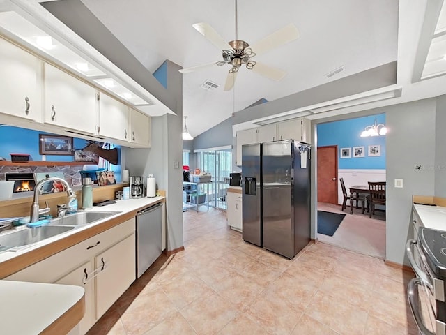 13094 Huntington Woods Ave, Spring Hill, FL 34609 - kitchen featuring appliances with stainless steel finishes, a sink, a ceiling fan, lofted ceiling, and light countertops