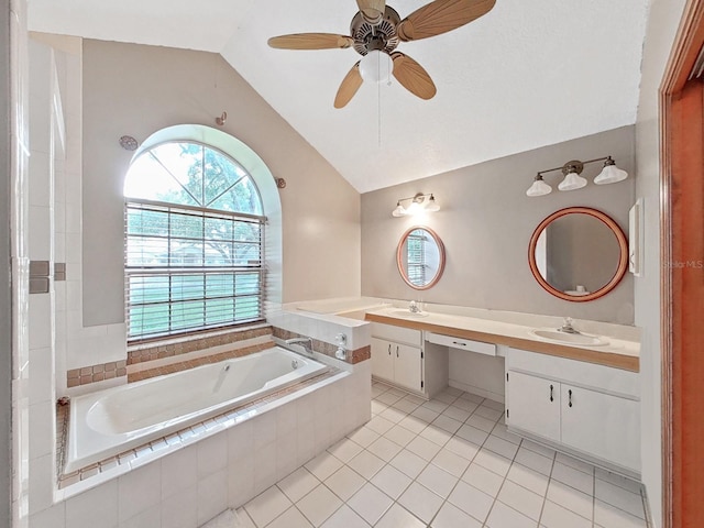 13094 Huntington Woods Ave, Spring Hill, FL 34609 - full bathroom with vaulted ceiling, double vanity, a bath, tile patterned floors, and ceiling fan