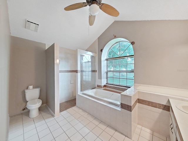 13094 Huntington Woods Ave, Spring Hill, FL 34609 - full bath featuring a garden tub, vaulted ceiling, tile patterned floors, vanity, and toilet