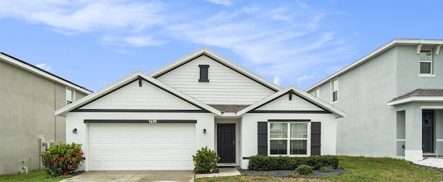 7639 Broad Pointe Dr, Zephyrhills, FL 33540 - view of front of home featuring driveway and a garage