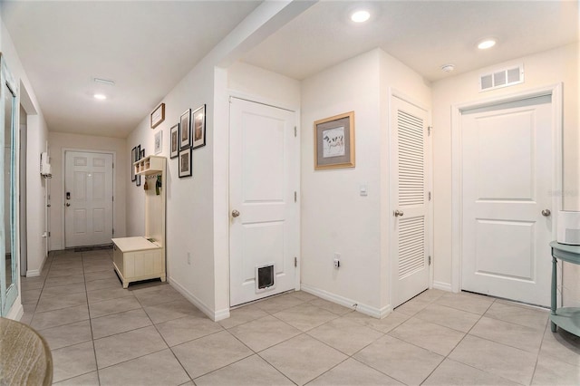 7639 Broad Pointe Dr, Zephyrhills, FL 33540 - foyer entrance with light tile patterned floors and recessed lighting