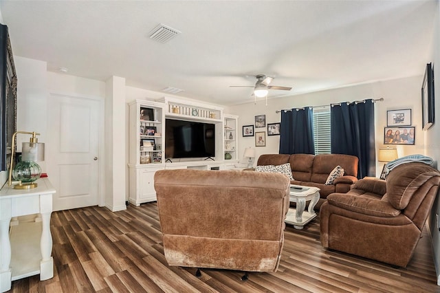 7639 Broad Pointe Dr, Zephyrhills, FL 33540 - living area featuring a ceiling fan and dark wood-style floors
