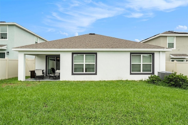 7639 Broad Pointe Dr, Zephyrhills, FL 33540 - rear view of property with a shingled roof, stucco siding, and a patio
