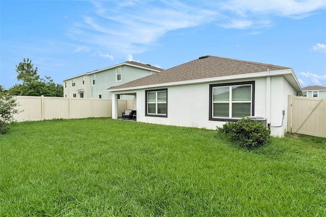 7639 Broad Pointe Dr, Zephyrhills, FL 33540 - rear view of property featuring a shingled roof, a fenced backyard, and stucco siding