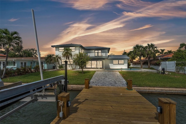 319 Midway Is, Clearwater Beach, FL 33767 - dock area featuring a balcony and a patio area