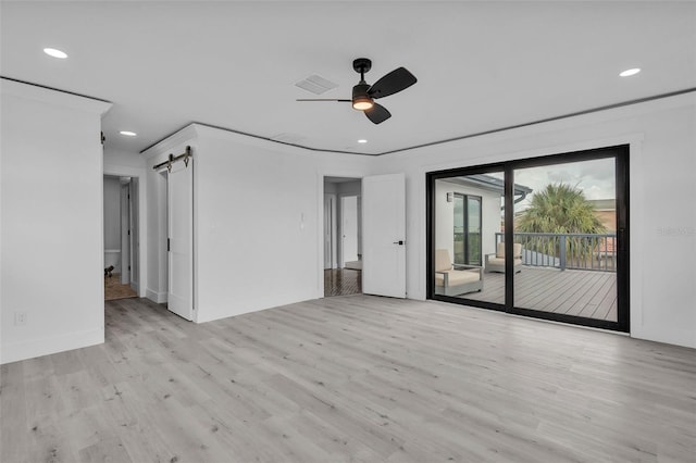 319 Midway Is, Clearwater Beach, FL 33767 - empty room with a barn door, light wood-style floors, recessed lighting, a ceiling fan, and baseboards