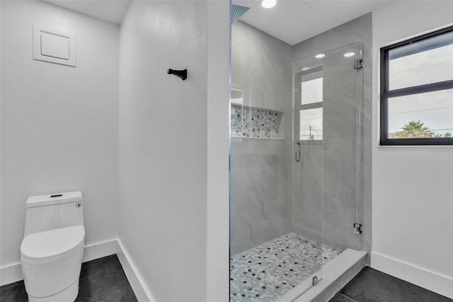 319 Midway Is, Clearwater Beach, FL 33767 - full bathroom featuring a stall shower, toilet, and baseboards