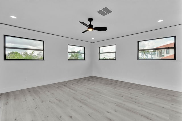 319 Midway Is, Clearwater Beach, FL 33767 - unfurnished room featuring wood finished floors, baseboards, recessed lighting, and ceiling fan