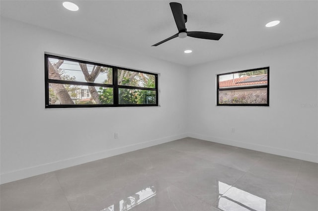 319 Midway Is, Clearwater Beach, FL 33767 - empty room with recessed lighting, healthy amount of natural light, baseboards, and ceiling fan