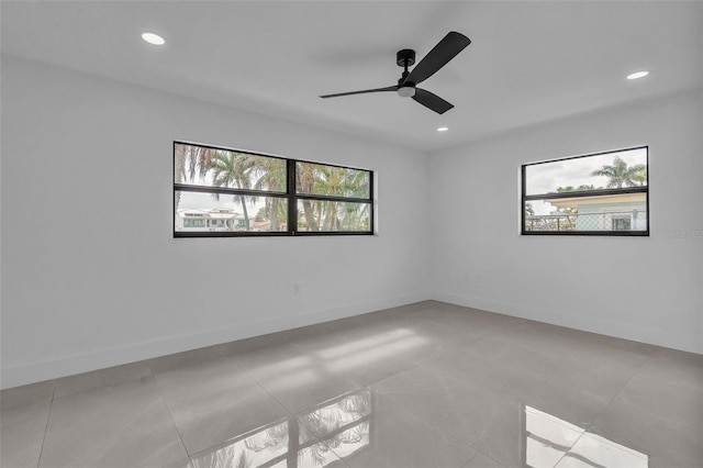 319 Midway Is, Clearwater Beach, FL 33767 - unfurnished room with recessed lighting, ceiling fan, baseboards, and light tile patterned floors