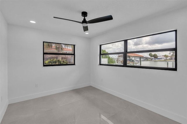 319 Midway Is, Clearwater Beach, FL 33767 - spare room with ceiling fan, baseboards, and recessed lighting