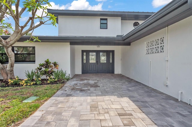 319 Midway Is, Clearwater Beach, FL 33767 - property entrance with stucco siding
