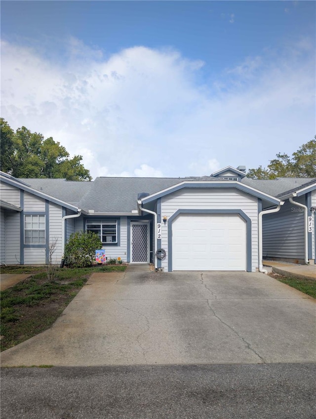 39650 US Highway 19 N, Tarpon Springs, FL 34689 - ranch-style home featuring a garage, asphalt driveway, and a shingled roof