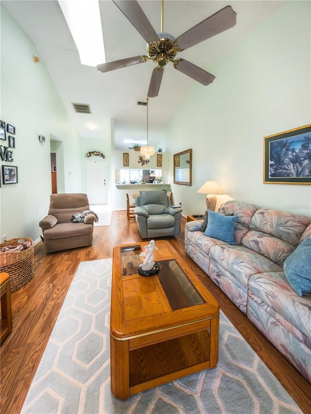 39650 US Highway 19 N, Tarpon Springs, FL 34689 - living room featuring high vaulted ceiling, wood finished floors, and a ceiling fan