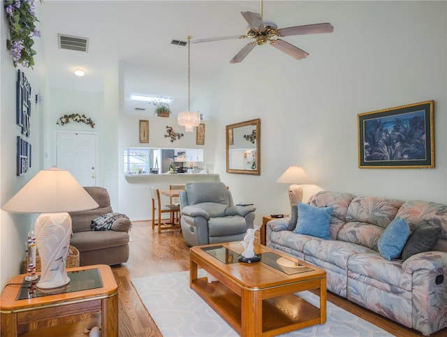 39650 US Highway 19 N, Tarpon Springs, FL 34689 - living area with wood finished floors, a towering ceiling, and ceiling fan