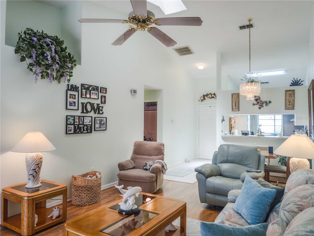 39650 US Highway 19 N, Tarpon Springs, FL 34689 - living area with wood finished floors, baseboards, a ceiling fan, and vaulted ceiling