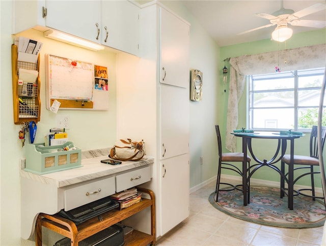39650 US Highway 19 N, Tarpon Springs, FL 34689 - kitchen featuring a ceiling fan, white cabinetry, baseboards, light countertops, and light tile patterned floors