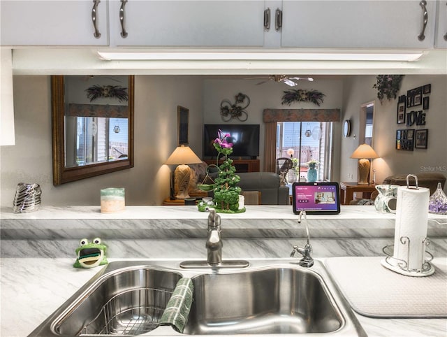 39650 US Highway 19 N, Tarpon Springs, FL 34689 - detailed view of a sink, ceiling fan, and light countertops